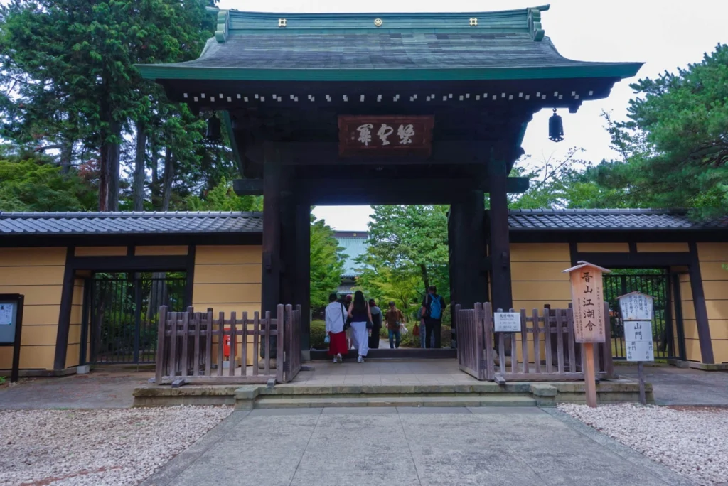 The traditional wooden entrance gate to Gotokuji lucky cat temple in Setagaya, Tokyo.