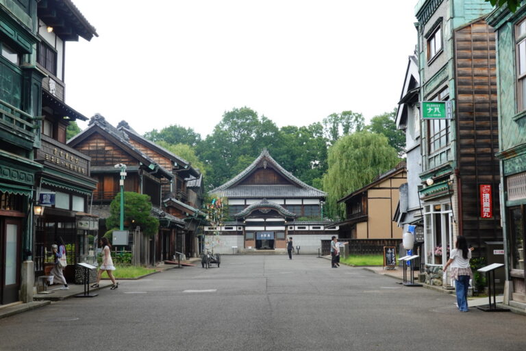 Copper clad shopfronts lining the East Zone street with the Kodakara-yu bathhouse at the far end