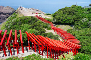 The 123 red torii gates of Motonosumi Inari running down to the sea