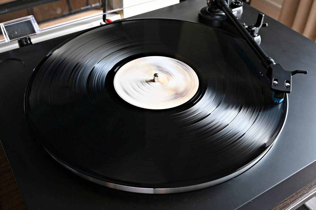 A vinyl record spinning on a turntable