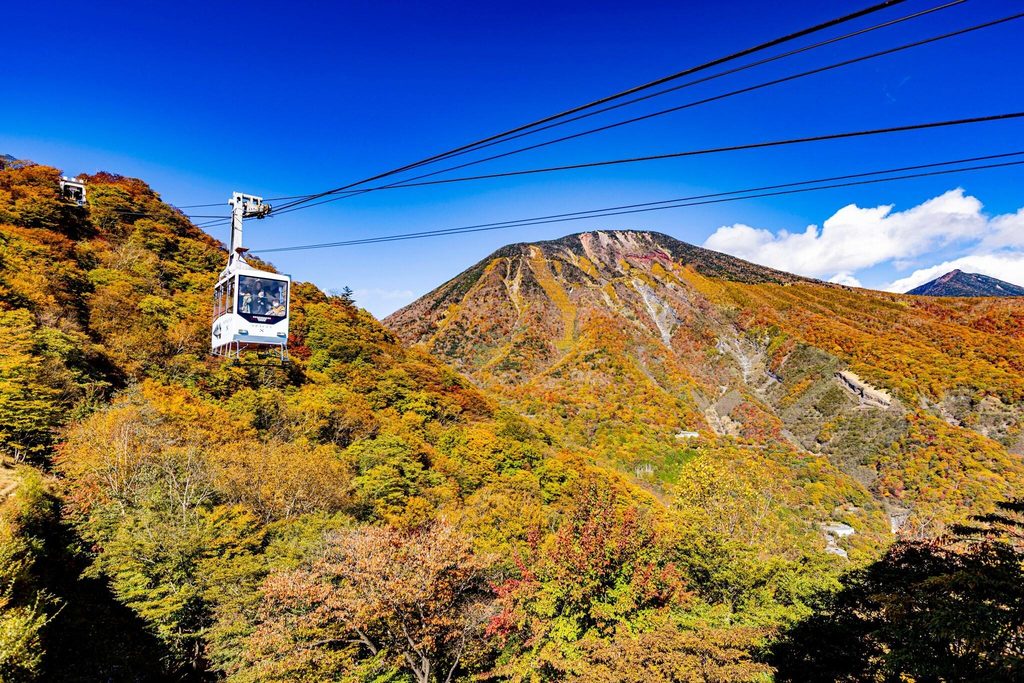 Ropeway over an autumn mountainside in Nikko, an early peak in the Japan autumn foliage forecast 2026