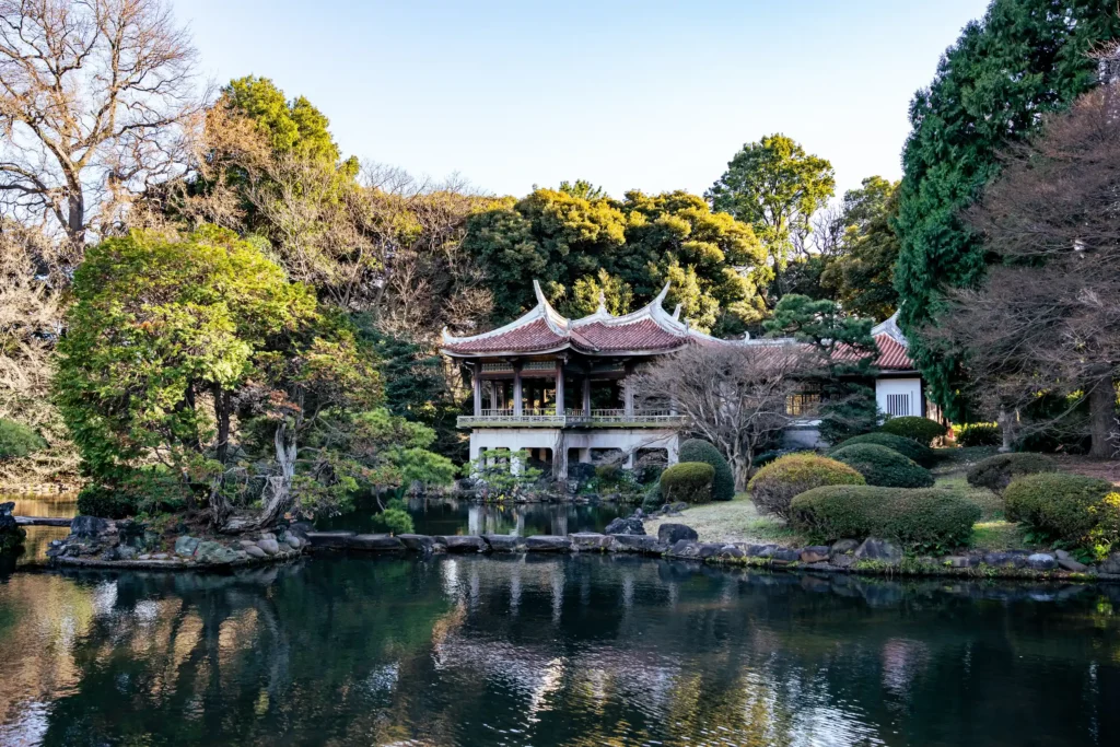 Traditional pavilion overlooking the pond at Shinjuku Gyoen National Garden