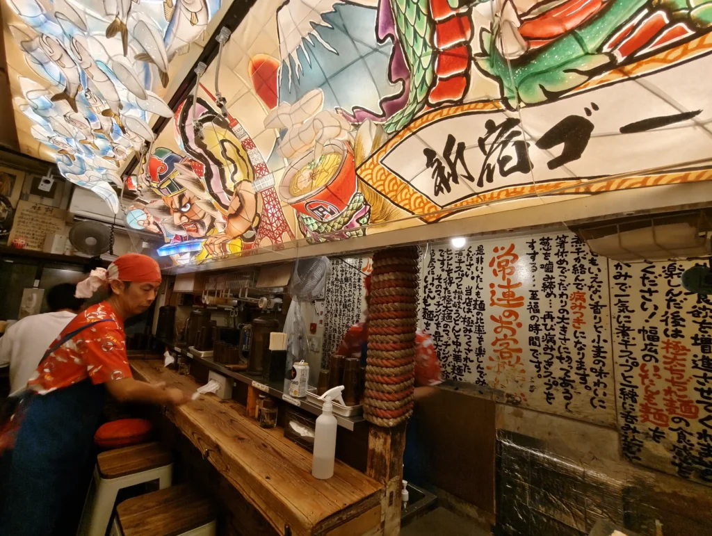 Counter seating and decor inside Sugoi Niboshi Ramen Nagi in Golden Gai