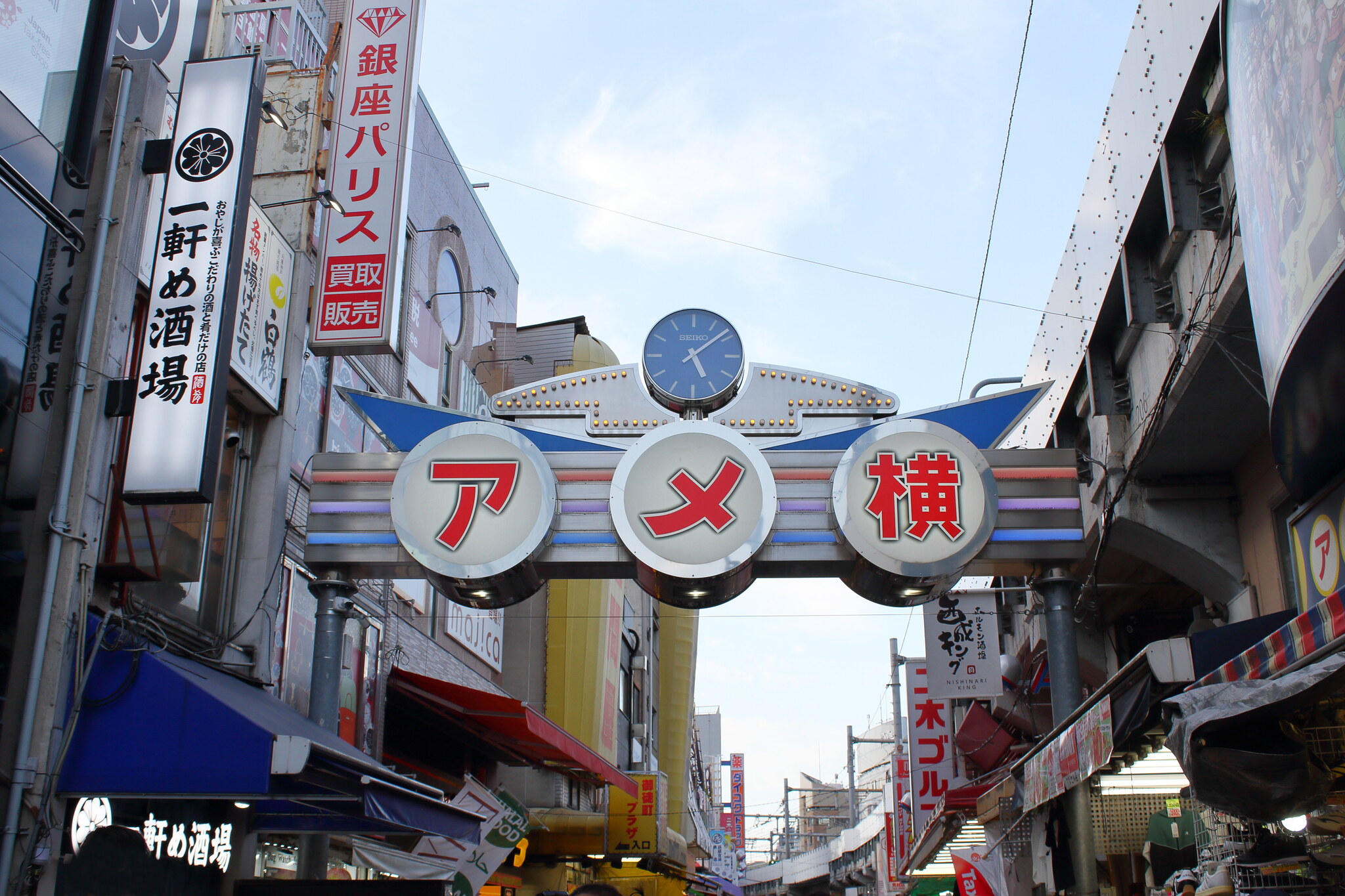 The Ameyoko gate in Ueno, Tokyo, with a Japan. Tax-free Shop sign on the corner building