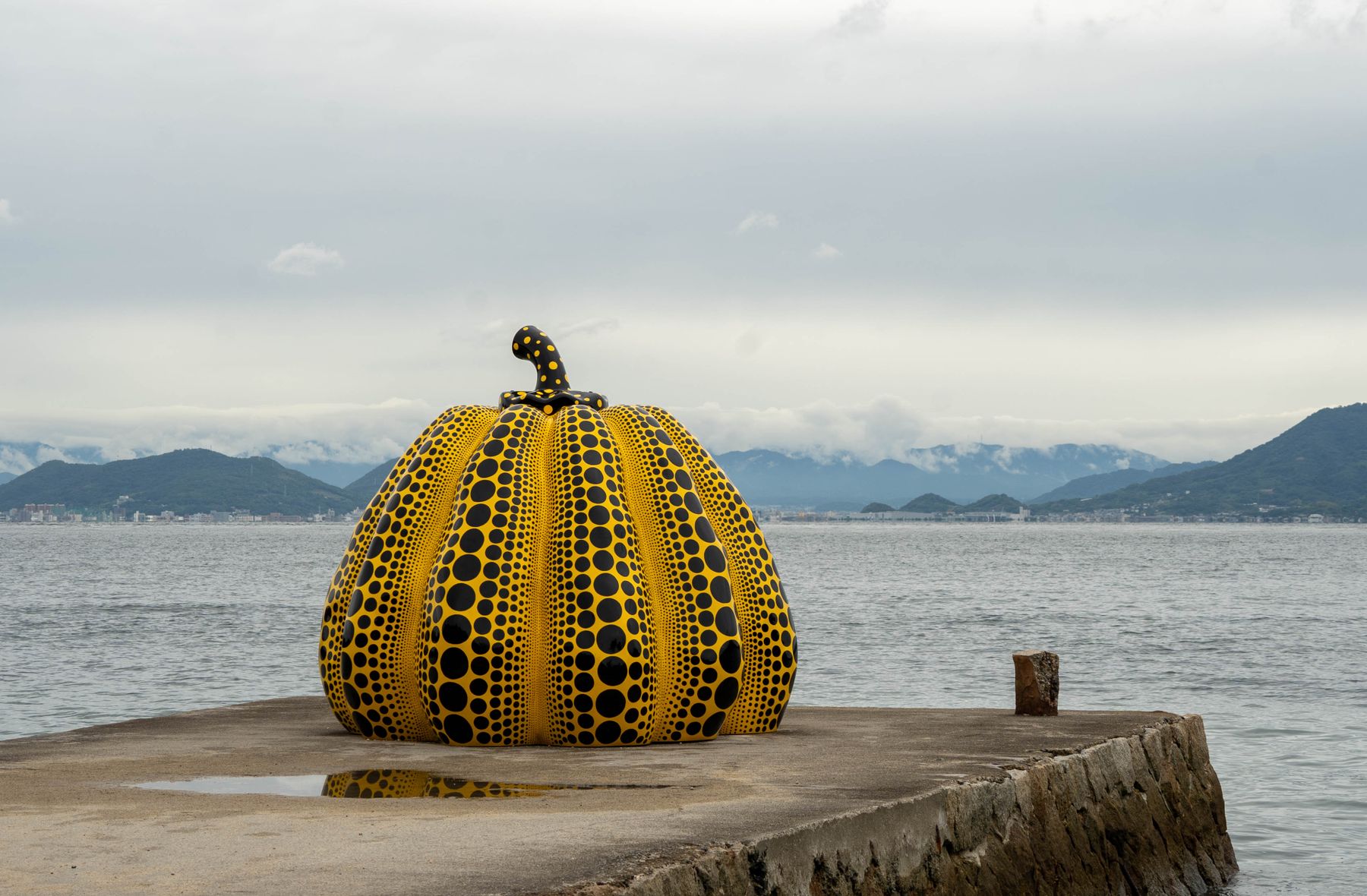 Yayoi Kusama's yellow pumpkin sculpture on the pier at Naoshima, one of the best-known museums in Japan for art