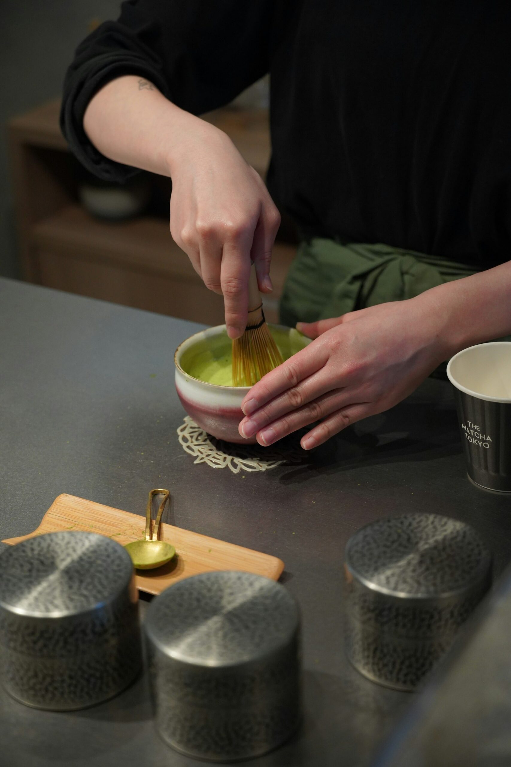 Authentic experiences in Japan: matcha being whisked in a tea bowl