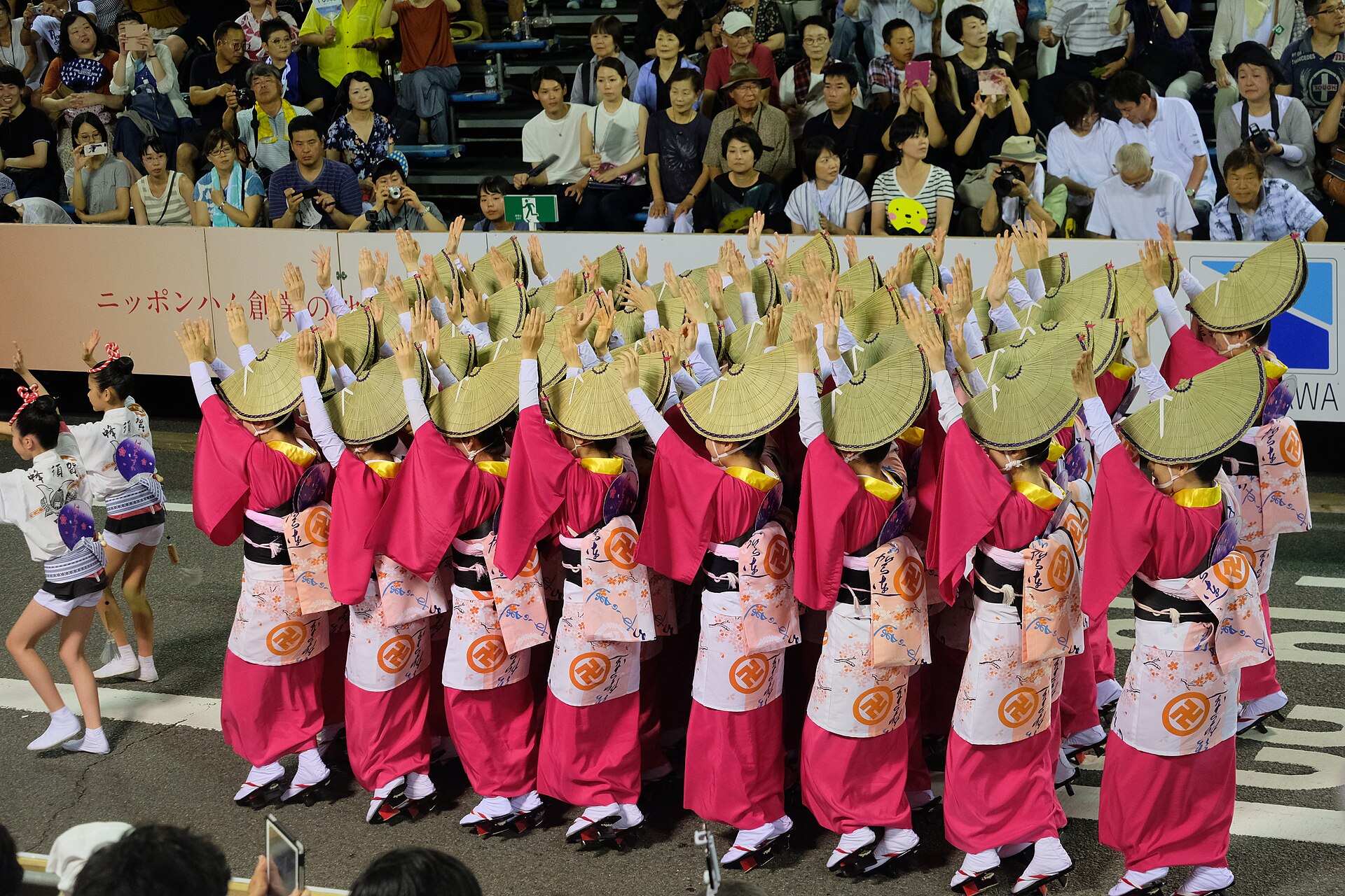 Women in amigasa straw hats dancing Awa Odori