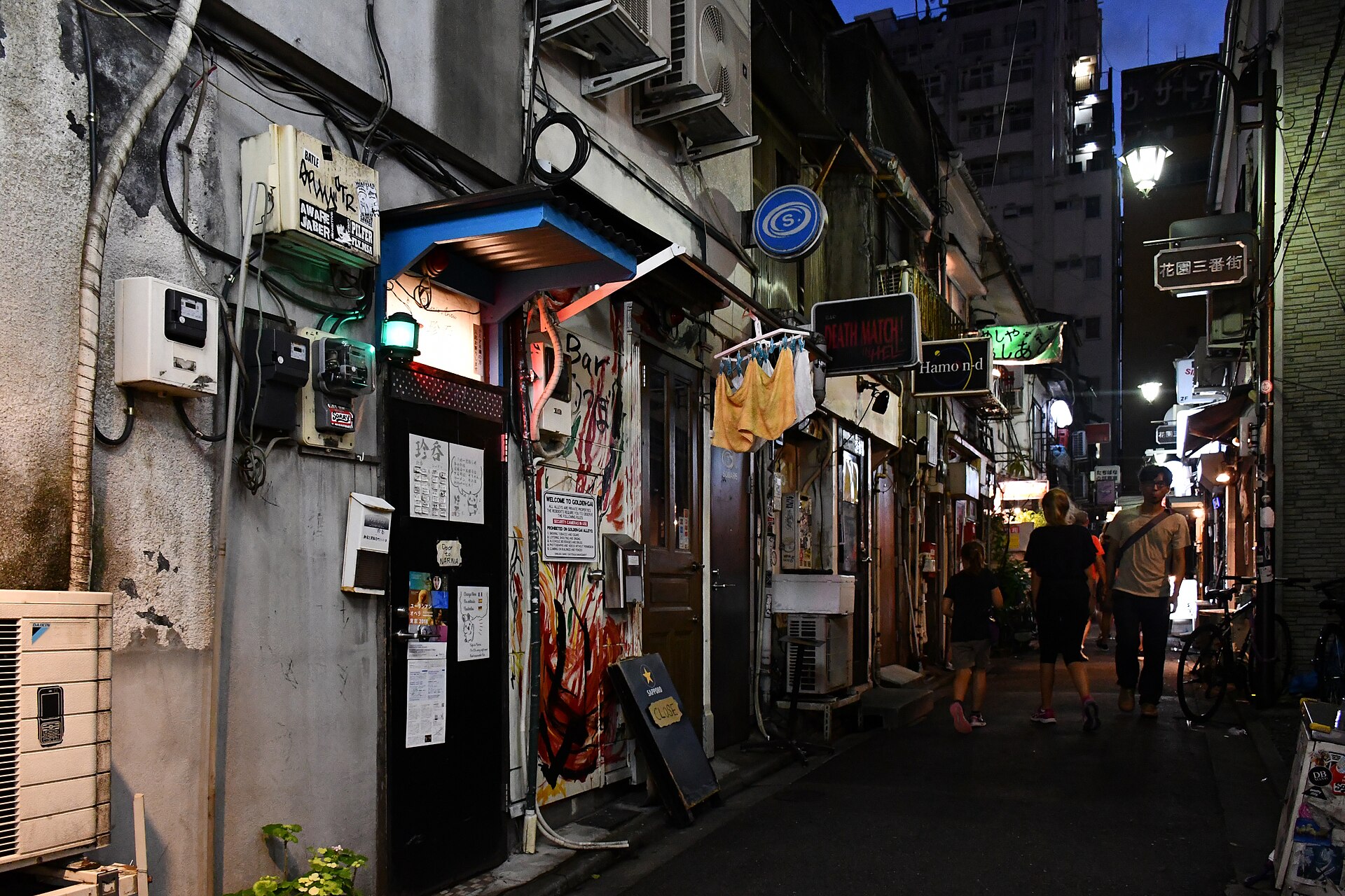 Best bars in Tokyo: a narrow bar alley in Golden Gai, Shinjuku, at night