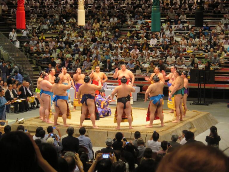 Wrestlers in the ring at a grand sumo tournament in Tokyo, the event most visitors want sumo tickets for