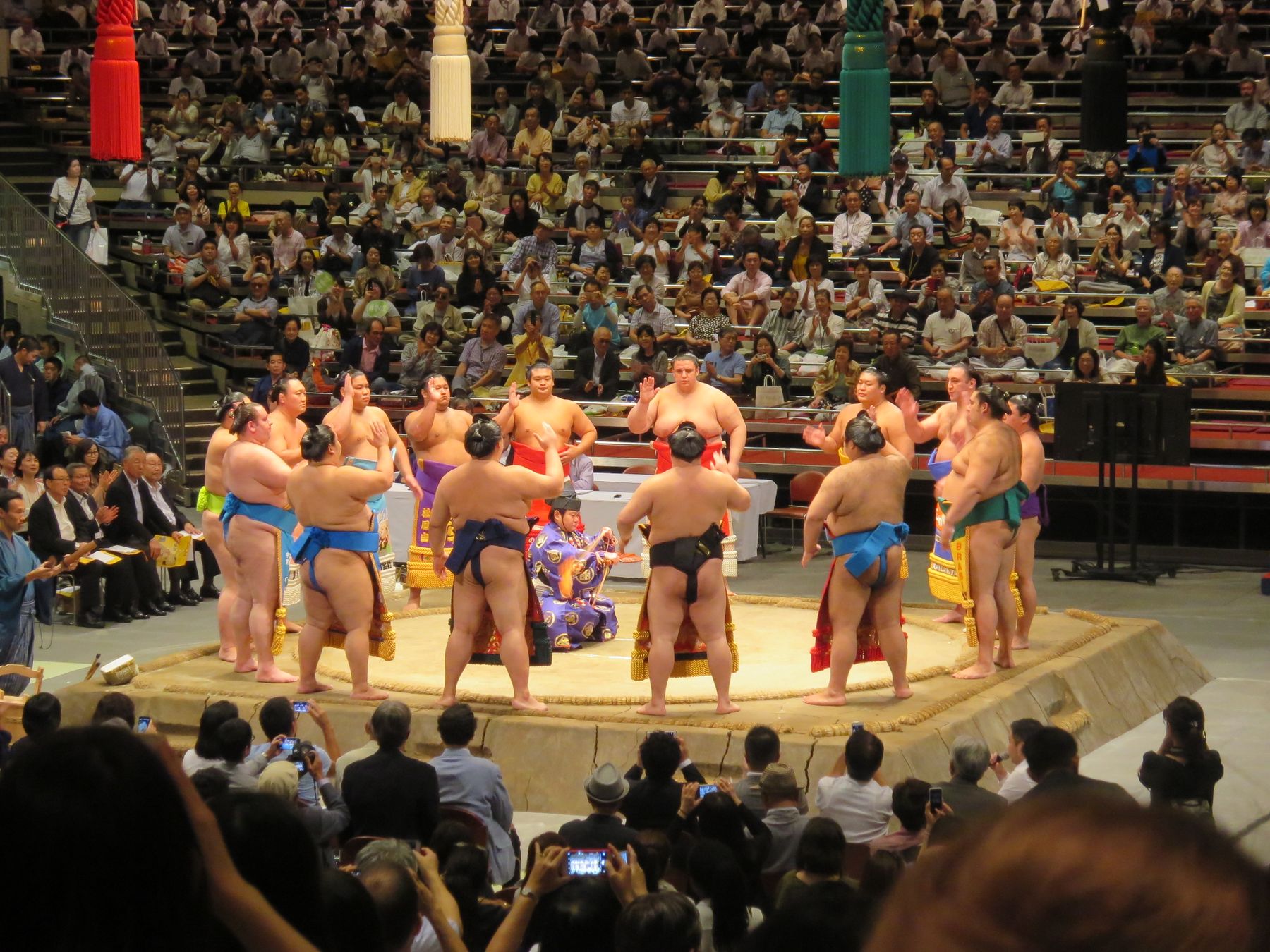 Wrestlers in the ring at a grand sumo tournament in Tokyo, the event most visitors want sumo tickets for