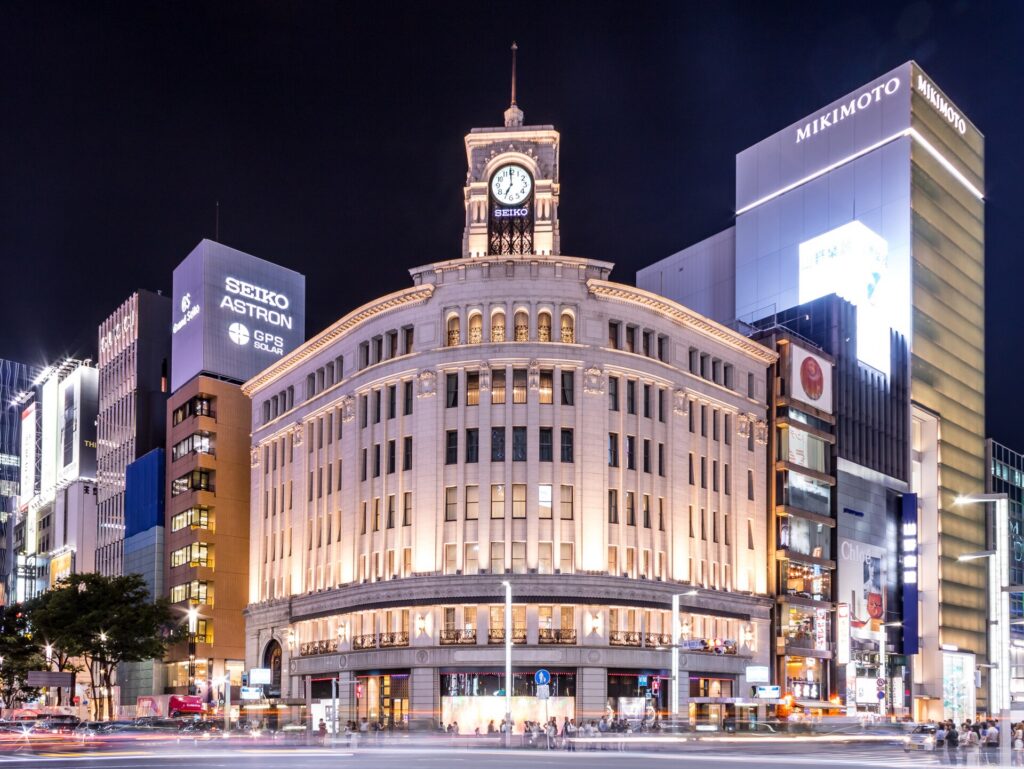 Ginza at night: the Wako clock tower at Ginza 4-chome crossing, lit up after dark