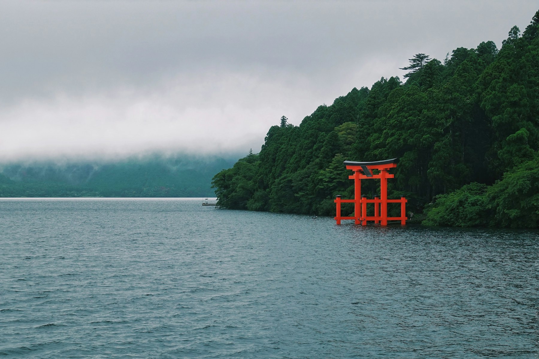 The red Peace Torii of Hakone Shrine standing in Lake Ashi