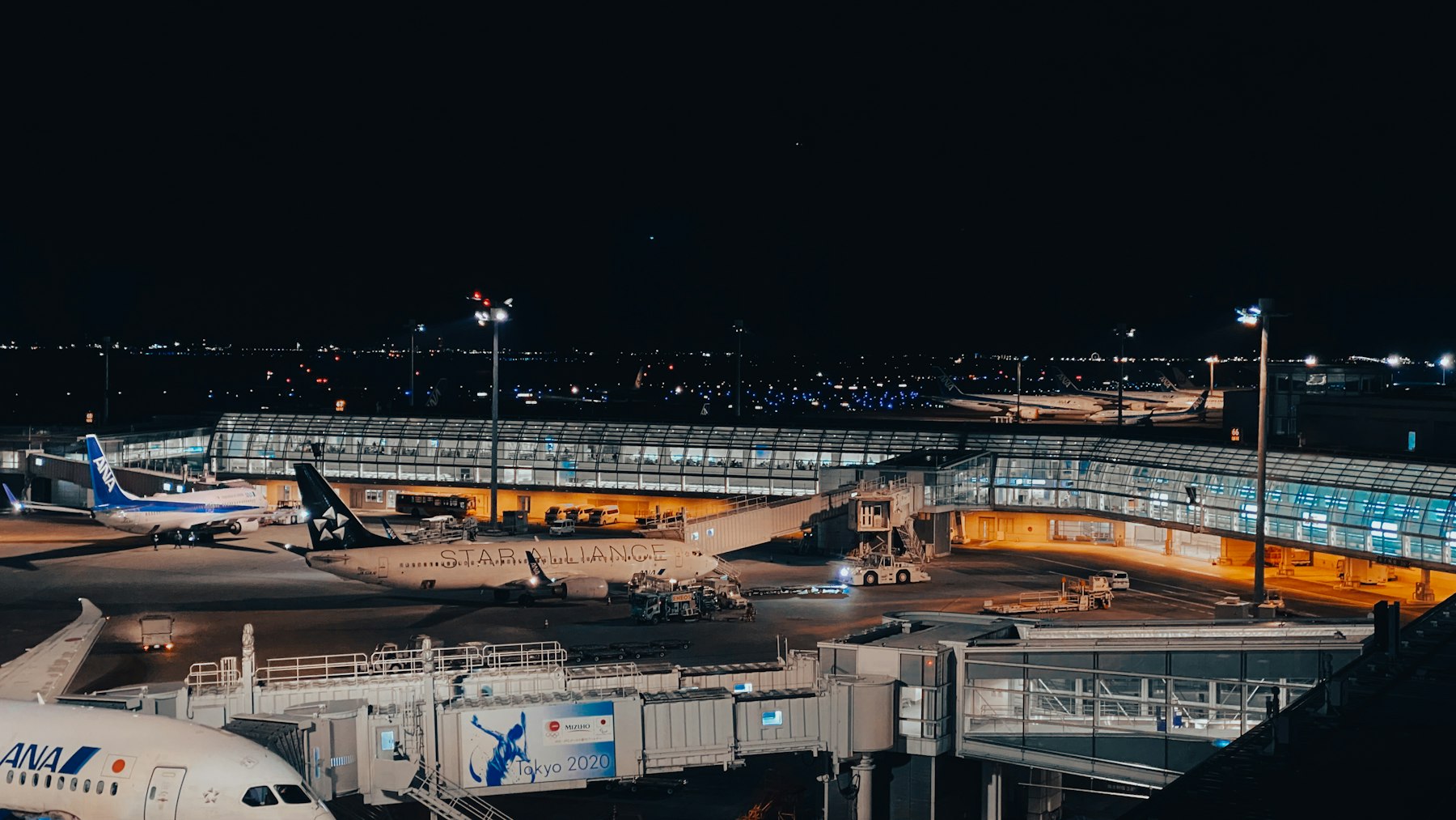 Haneda Airport terminal and aircraft at night
