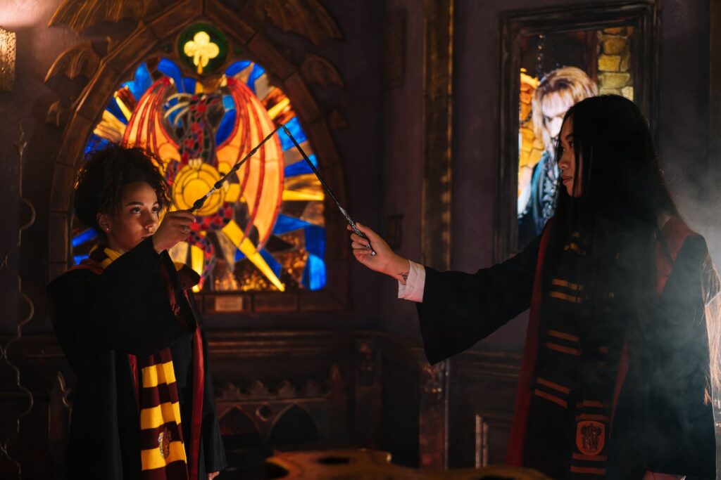 Fans in wizard costumes holding wands, a popular Harry Potter Studio Tour Tokyo photo idea