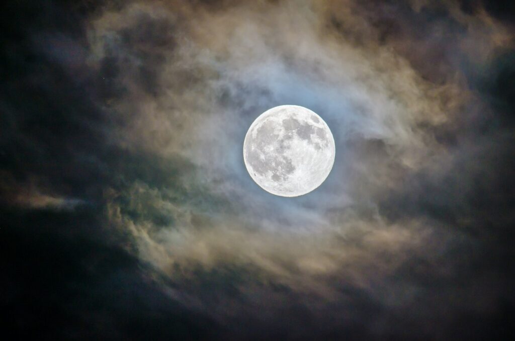 A full moon glowing through thin cloud, the hazy oborozuki moon that inspired Byredo Oboro