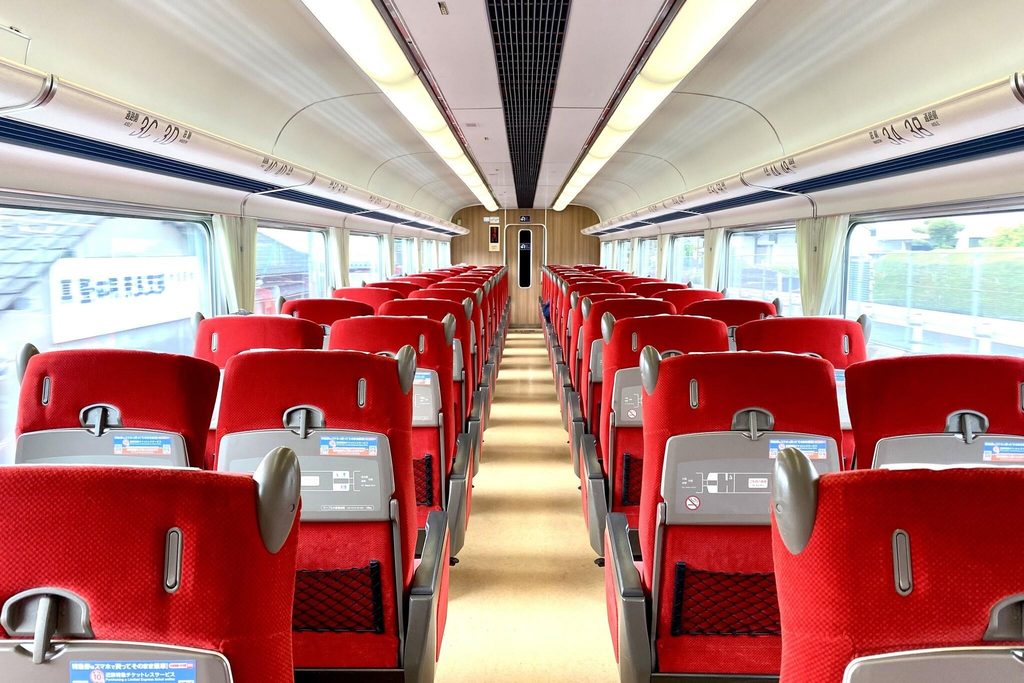 Red seats inside a Kintetsu limited express, on the railway that runs to Toba Station for Toba Aquarium Red seats inside a Kintetsu limited express, on the railway that runs to Toba Station for Toba Aquarium