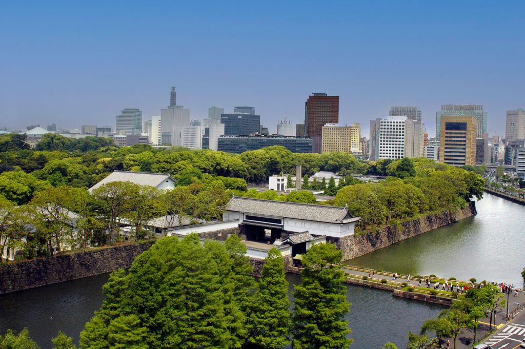 Imperial Palace East Gardens entrance and moat with the Marunouchi skyline behind, Tokyo