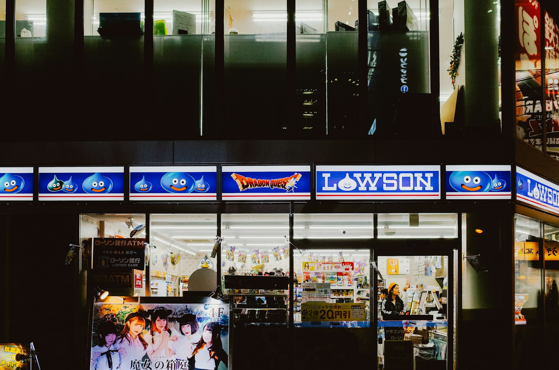 Lawson convenience store lit up at night in Chiyoda, Tokyo, where Japan travel cost stays low for snacks and meals