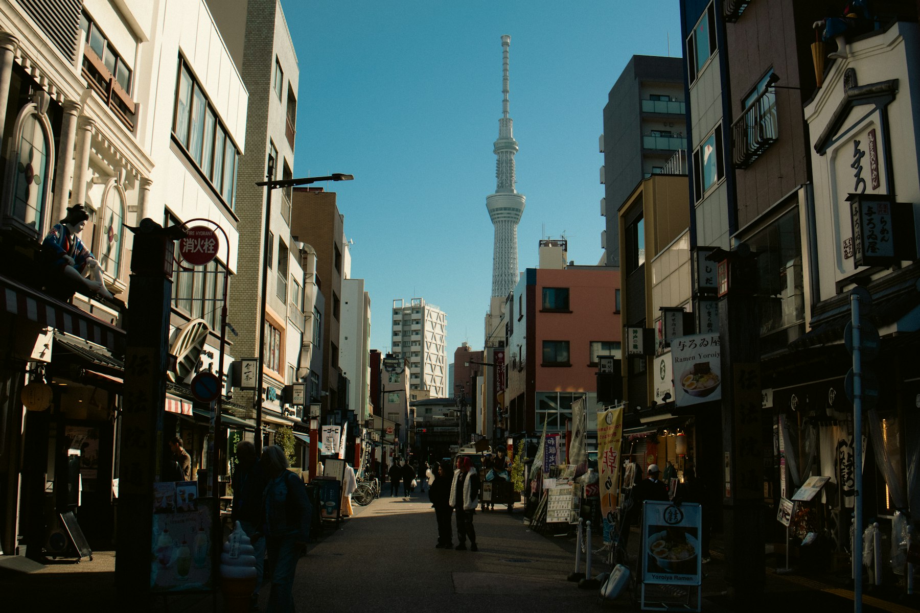Tokyo street with Tokyo Skytree rising in the distance