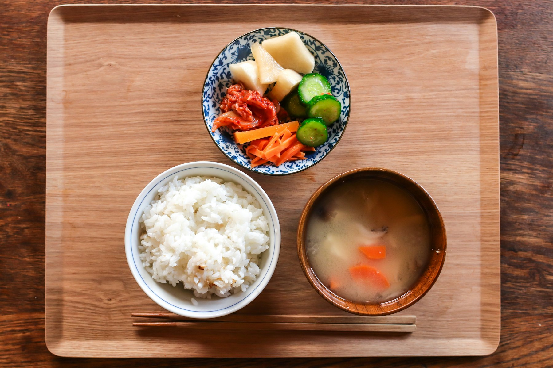 Simple Japanese set of rice, soup and vegetables on a tray