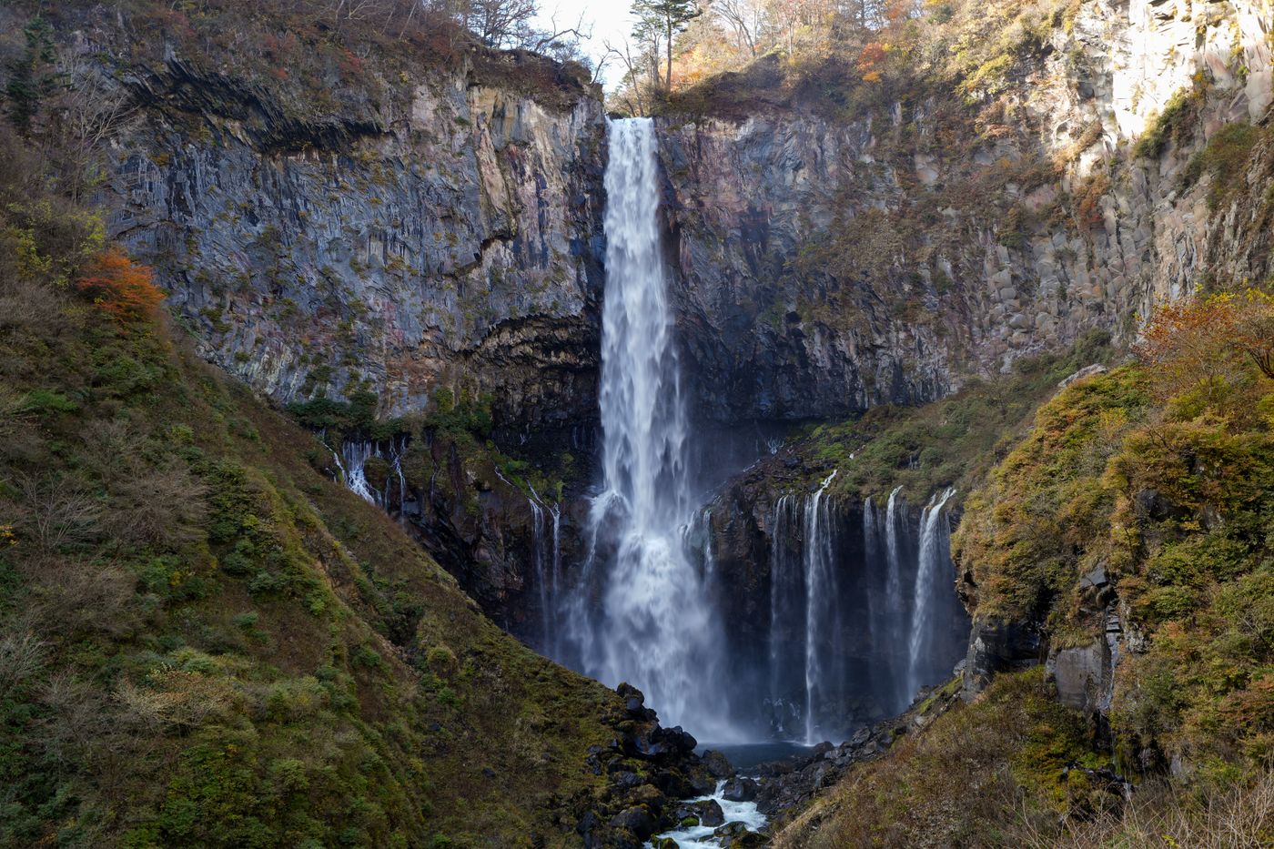 Kegon Falls, Nikko, Tochigi, Japan: 97-metre waterfall with smaller cascades and autumn trees beside it