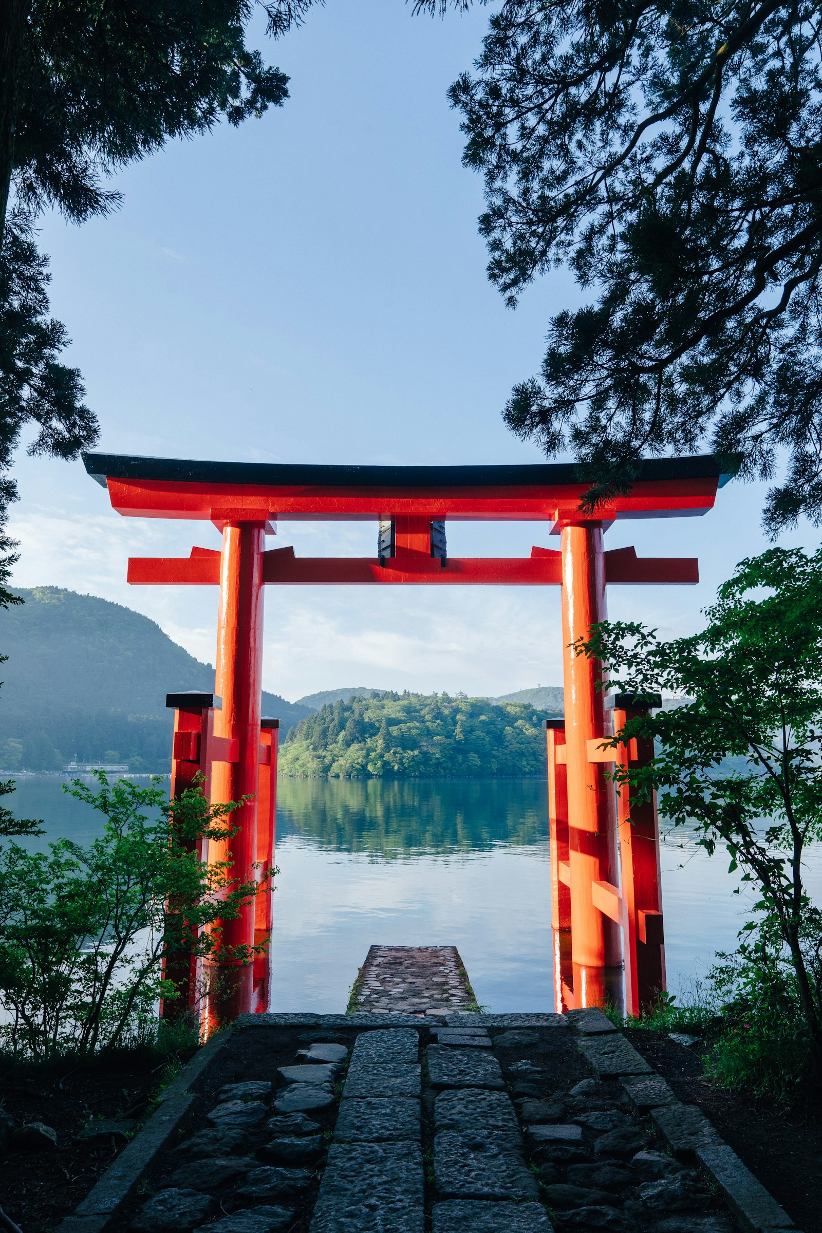 Red torii gate of Hakone Shrine on Lake Ashi, a stop on Fuji and Hakone day tours
