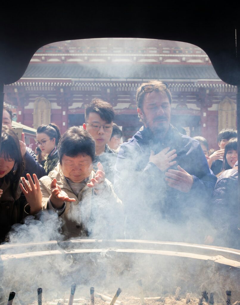 Senso-ji temple in Asakusa with visitors around the incense burner