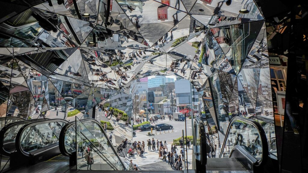 The mirrored entrance escalator on Omotesando, Tokyo&rsquo;s fashion and fragrance street