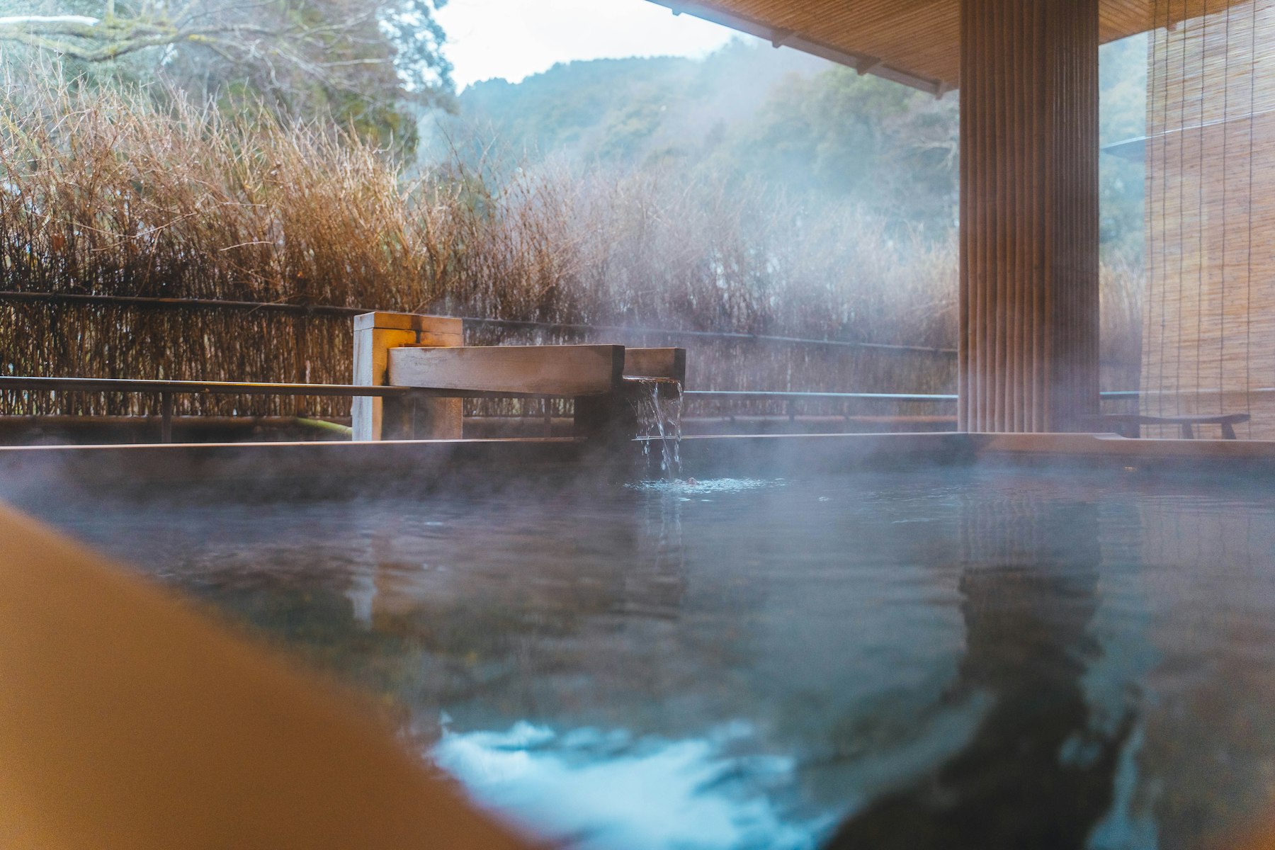 Onsen etiquette: a steaming outdoor hot spring bath in Japan
