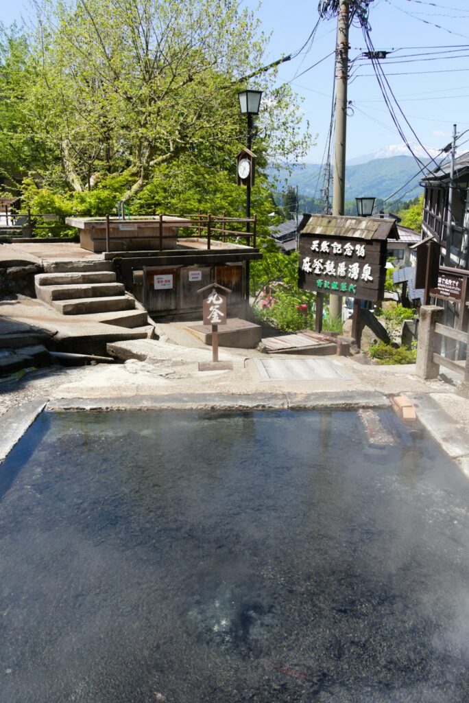 Steaming outdoor hot spring in Nozawa Onsen village, onsen after skiing