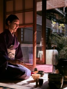 Woman in kimono performing a Japanese tea ceremony