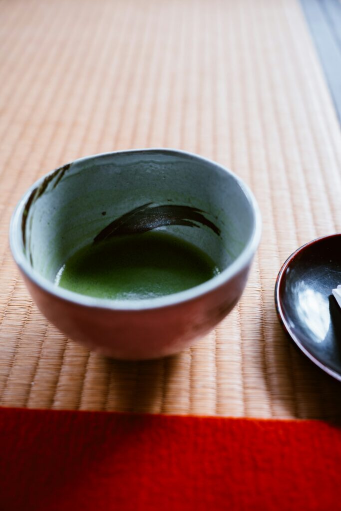 Bowl of frothy usucha matcha tea on a mat