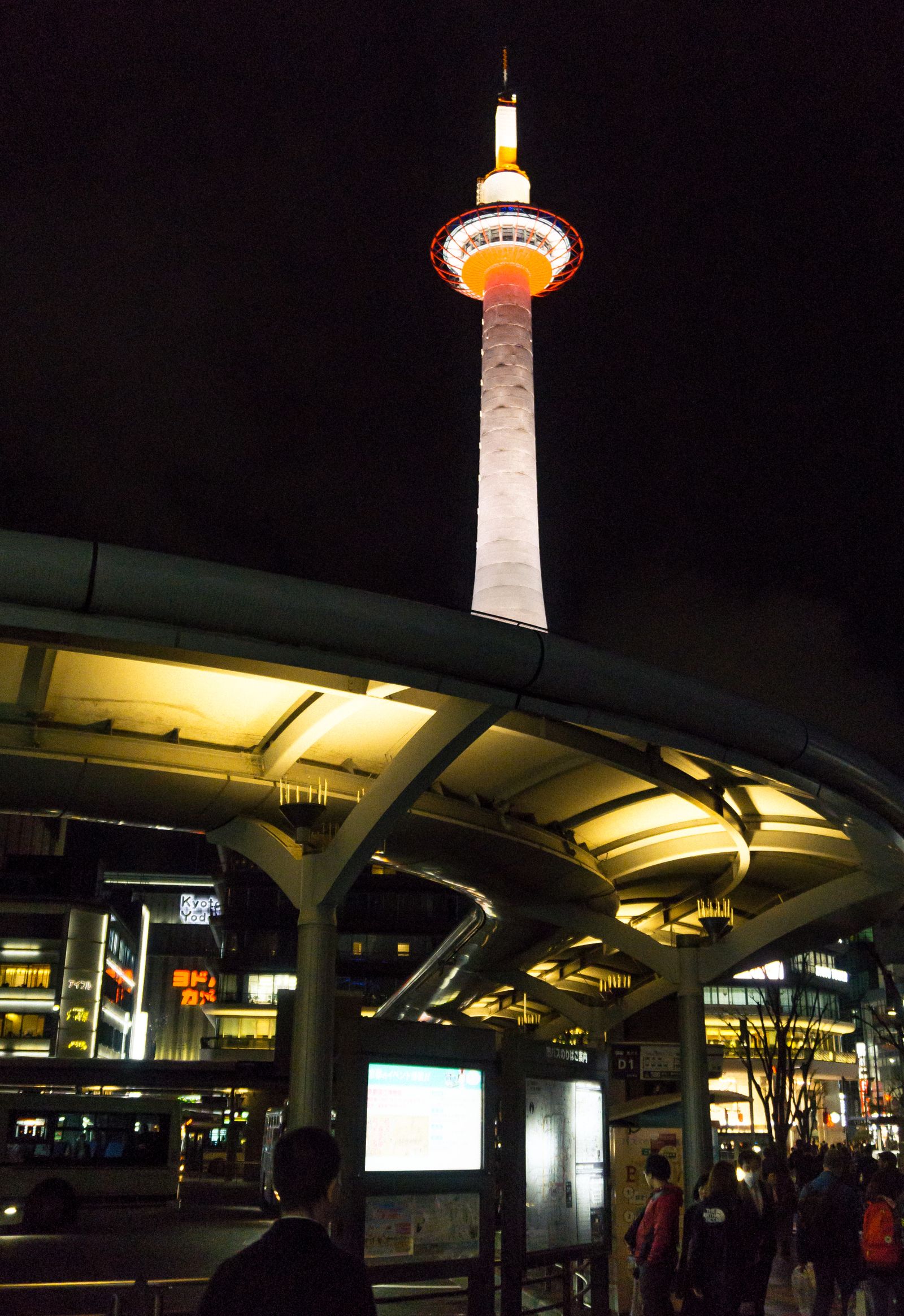 Kyoto Tower lit up at night near Kyoto Station, the gateway to teamLab Biovortex Kyoto