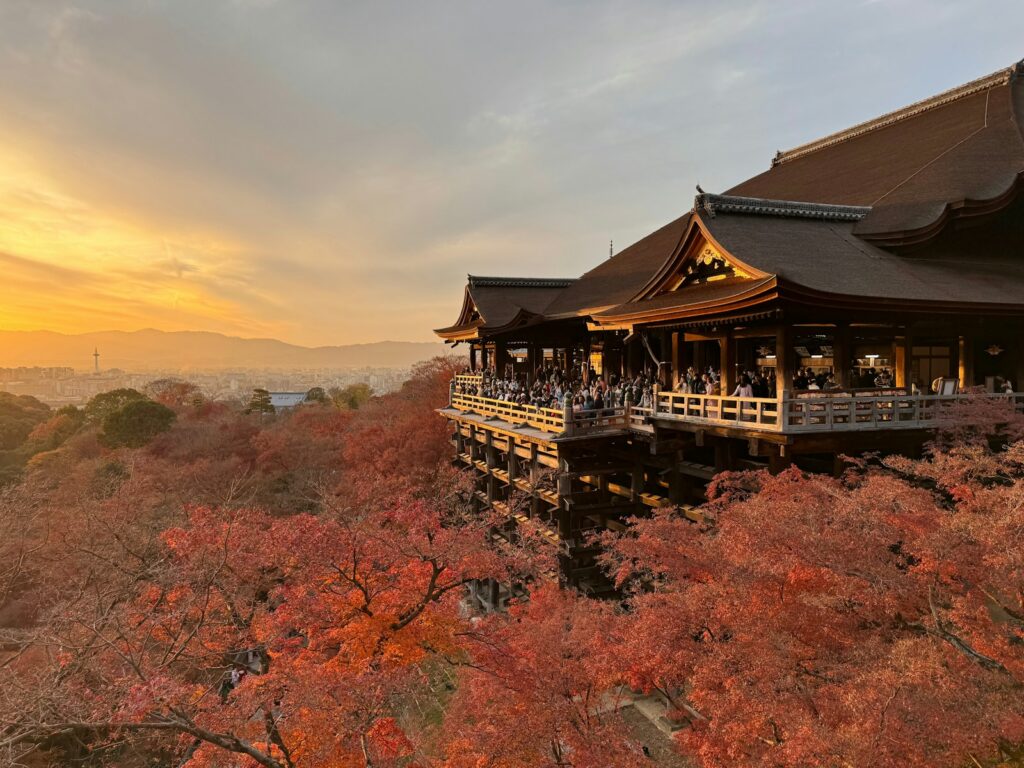 Kiyomizu-dera stage above autumn leaves at sunset in Kyoto