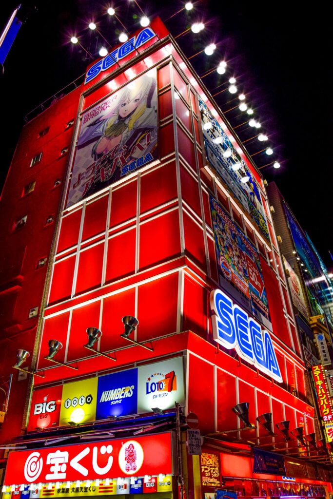 Akihabara guide: red arcade building lit up at night in Akihabara