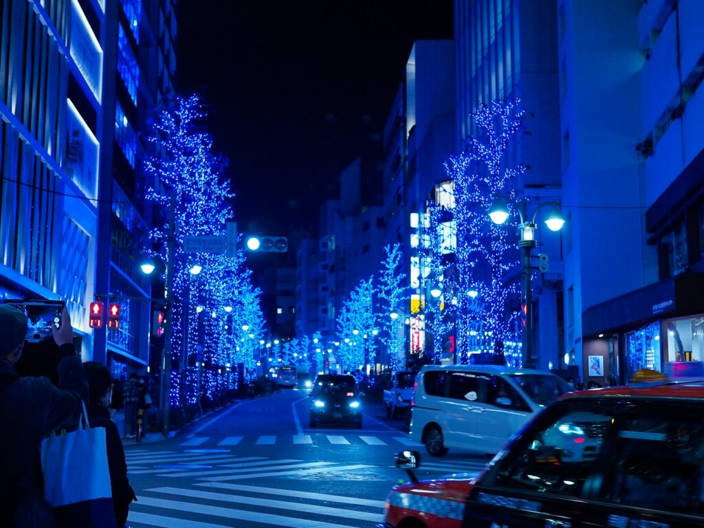 Tokyo illuminations 2026: blue Christmas lights over a Shibuya street at night
