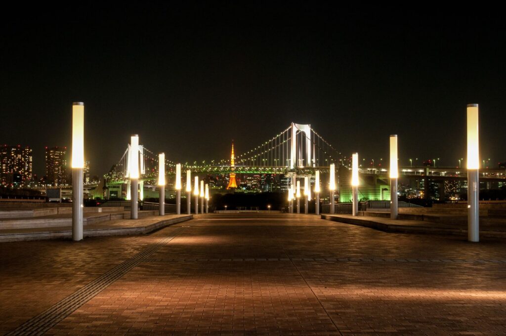 Rainbow Bridge illuminated over Tokyo Bay at night, near Oi Racecourse illumination